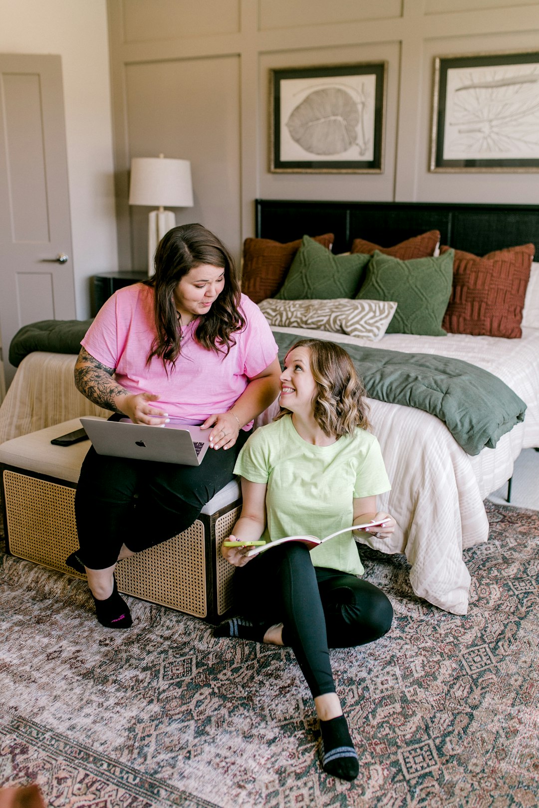 two-women-working-on-a-laptop-and-book-n62lfofqfao