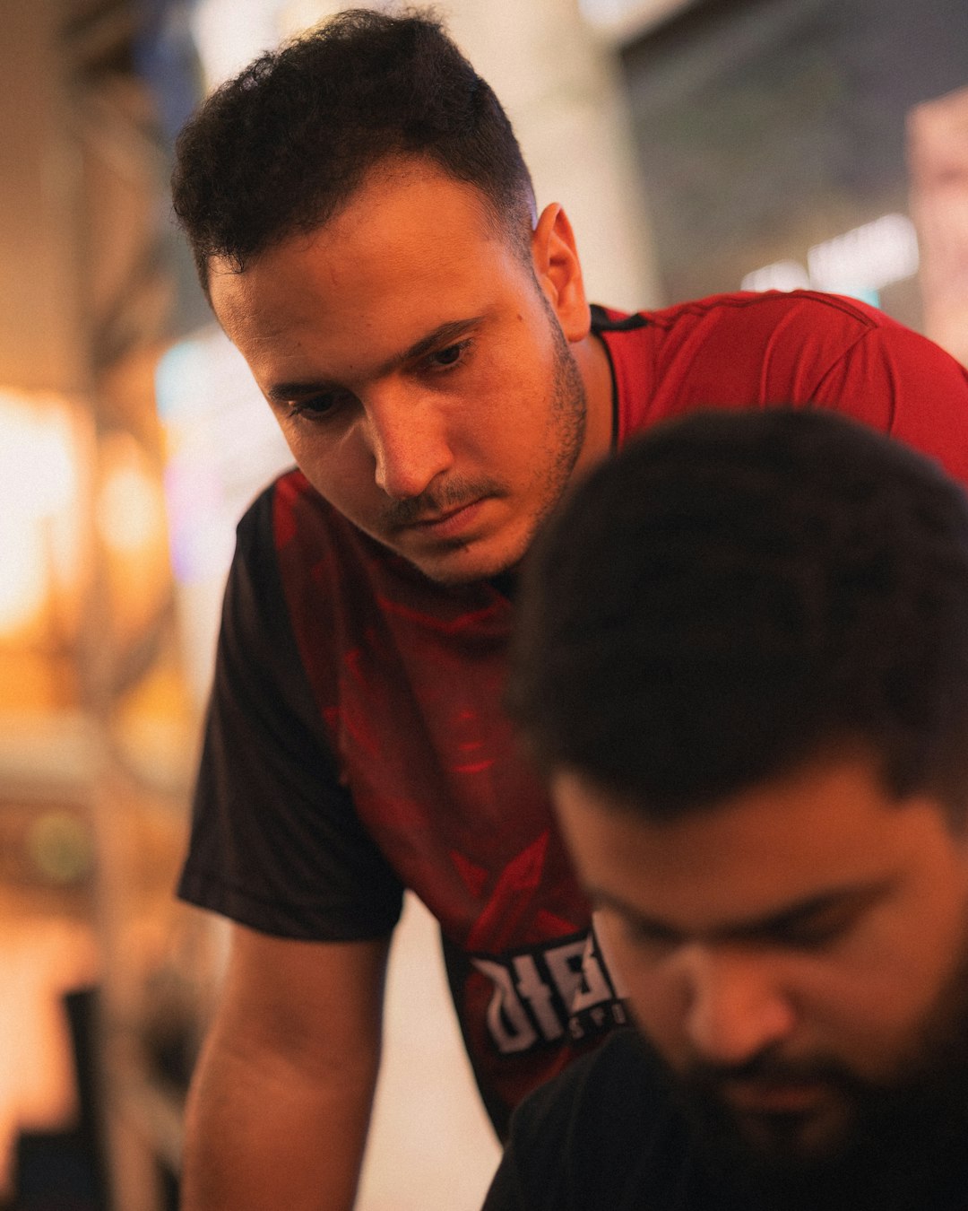 two-men-looking-down-intently-at-something-3rpqoi6qhi8